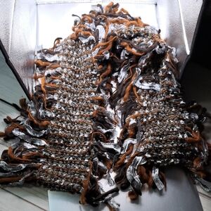 Eyeful Fringe Knit Scarf in Brown And Silver Has Faux Feather Detail